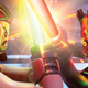 A screenshot shows two Lego characters from Star Wars fighting with lightsabers.